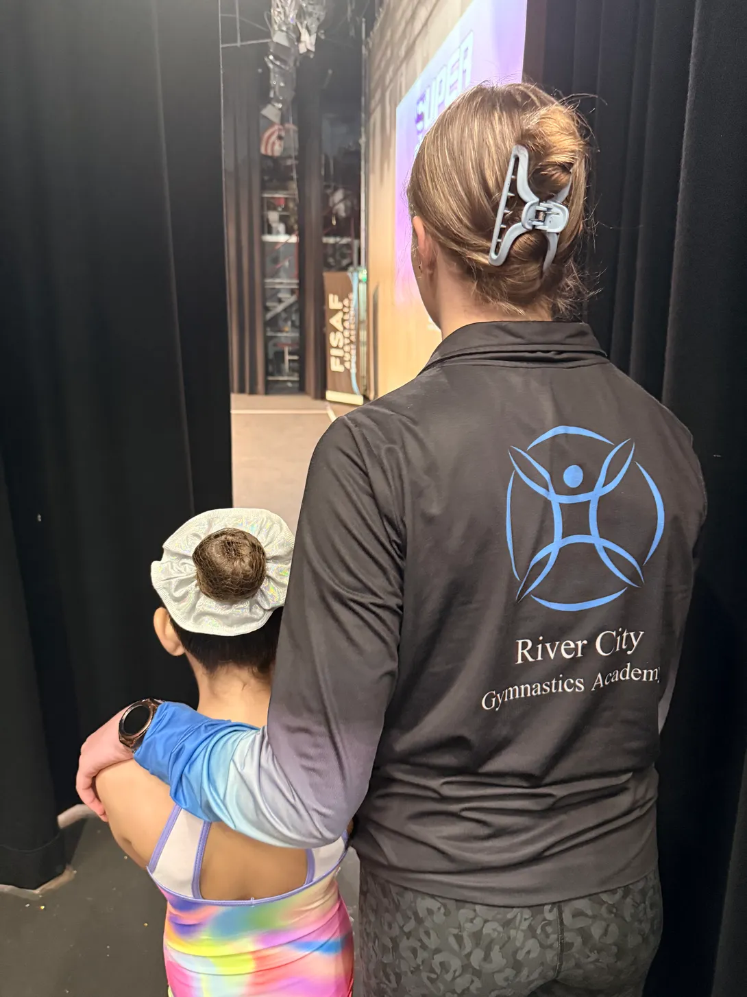 gymnasts-backstage-stage-lights